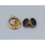 A 9ct stamped late 19th/ early 20th century photograph locket (at fault) with bezelled glass in