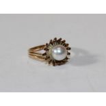 A cultured pearl ring, yellow metal, size E, 3gms gross approx, unmarked
