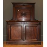 A late Victorian carved mahogany chiffonier of large size having a central carved back panel, over