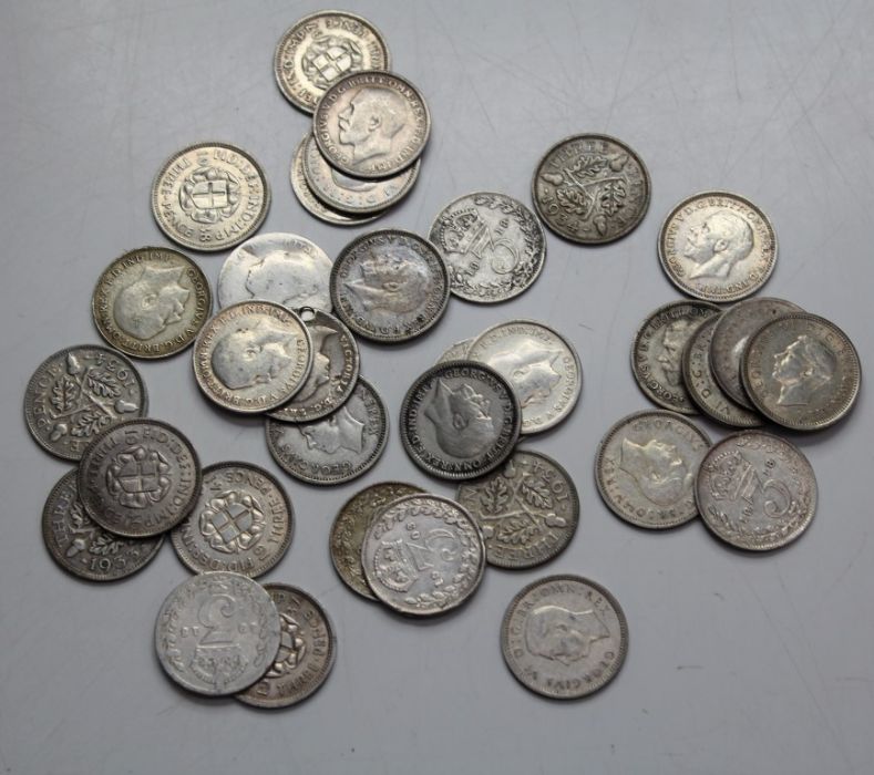 Thirty three silver threepences, dates 1910 to 1940, good quality and silver content