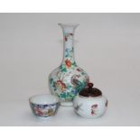 A 19th century Chinese famille rose onion form vase with flared rim, decorated with Ho-Ho bird,