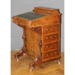 A Victorian walnut, florally boxwood strung Davenport desk, with covered stationary compartment