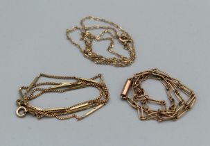 Three chains. A curb and bar 9ct chain (hallmarked), approximate weight 3.6gm, along with a 16