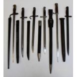 Six WWI bayonets, including a German Luneschloss, the guard numbered 27393, two American