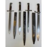 A WW1 German butcher blade bayonet with metal scabbard together with three other German WW1 bayonets