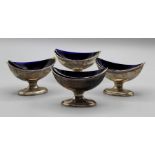 Robert Hennell, a set of four George III silver navette form pedestal salts, each with blue glss