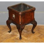 A George III style elm small jardinière of square outline having a brass liner, raised on cabriole