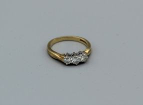 An 18ct threestone diamond ring, 3.8gm approx