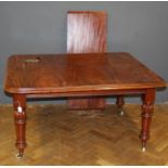 A late Victorian draw leaf dining table raised on ring turned legs and castors, length 137cm