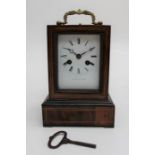 A 19th century French rosewood mantle clock, the stepped rectangular case with florally cast bail