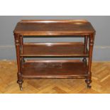 A Victorian mahogany dwarf three tier dumb waiter, raised on short turned legs and castors, width