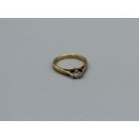 An 18ct gold diamond solitaire ring, hallmarked Birmingham, size J, 2.4gm