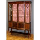 An Edwardian mahogany, ebony and boxwood strung vitrine of break bow front form, the moulded cornice