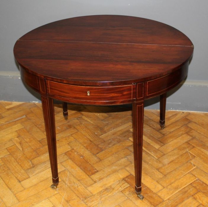 George III mahogany supper table, the satinwood crossbanded demi-lune fold over top with double gate