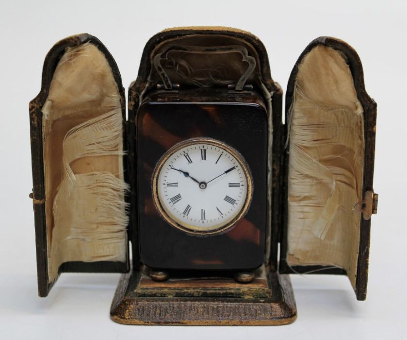 William Comyns and Sons Ltd, a George V silver mounted tortoiseshell cased travelling timepiece, the