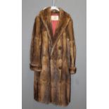 Hickley's, Southampton and Winchester, an early 20th century lady's three quarter length fur coat