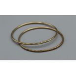 A pair of 9ct diamond cut bangles, weight approximately 10.7gm, both hallmarked 9ct
