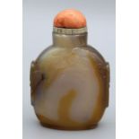 Chinese snuff bottle. Chalcedony of compressed ovoid form raise on a neatly finished footrim and