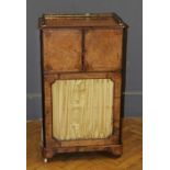 A Victorian walnut lady's music cabinet/ bonheur de jour. The three quarter gallery top over a