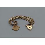 A 9ct gold charm bracelet with an ' I love you' spinner charm, 8.4gm