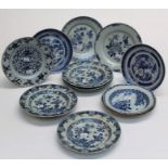 A set of five 19th century Chinese export blue and white 23cm diameter dishes, each decorated with