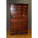 A George III walnut chest on chest, the moulded cornice over three short and three long drawers