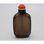 Chinese snuff bottle. Flawless smoky quartz (tea crystal) of flattened rounded rectangular form with