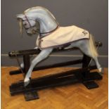 A 20th century Lines type rocking horse, grey painted with glass eyes, golden mane and tail, on a