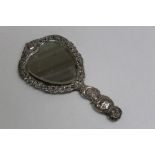 A sterling silver handmirror by William Comyns and Sons, London 1890 with pierced and cast