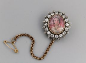 A diamond set brooch featuring a portrait of Queen Victoria as a young woman, the the Queens Royal