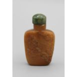 Chinese snuff bottle. Two tone quartzite of flattened tapering rectangular shape, each main side a