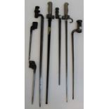 Seven WWI and other socket bayonets, including an Enfield numbered 601, a screwdriver tip bayonet,