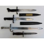 Two Spanish WW2 bayonets, one stamped Toledo to blade together with an American M1 bayonet and an
