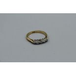 A five stone diamond ring in yellow metal stamped 18ct, gross weight approximately 3.2gm, size N