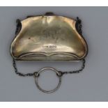 A sterling silver purse and chain, hallmarked for Chester, engraved with initials ML, 60.1gm (1.93