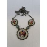 A micro mosaic necklace made up of five panels in white metal. In excellent condition