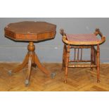 A reproduction mahogany lamp table, the tooled hide set rectangular top over four frieze drawers, on