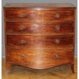 An early 19th century mahogany chest of bow front form, the crossbanded top over four graduated long