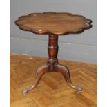 A 19th century, George II style tripod table, the scallop moulded snap top on a ring turned baluster