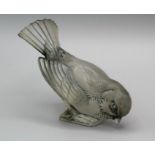 A Lalique moulded glass model of a sparrow with tail feathers raised, 11 x 10cm, numbered K 1150.