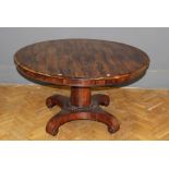 An early 19th century Rosewood breakfast table, the circular tilt top on a stout column with