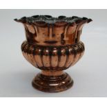 A Victorian copper wine cooler of campagna form, on stepped circular foot,, 26.5cm high