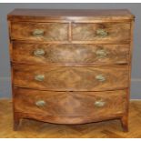 An early Victorian mahogany veneered bowfront chest, having two short and three long drawers