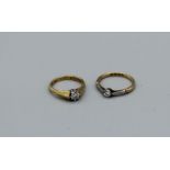 A pair of diamond solitaire rings, one a Roman set old cut diamond, size L, approximately 2.1gm, the