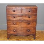 An early 19th century mahogany chest, the rectangular top over two short and three graduated long
