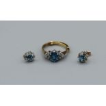 A pair of 9ct gold topaz and diamond ear studs along with a 9ct gold topaz and white stone ring (