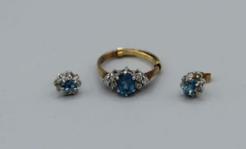 A pair of 9ct gold topaz and diamond ear studs along with a 9ct gold topaz and white stone ring (