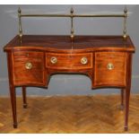 A mid 19th century mahogany serpentine fronted sideboard of small proportions with brass rail, the