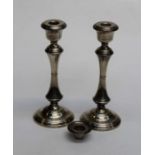 A pair of loaded silver candlesticks, the spreading circular bases rising to knopped column and bell