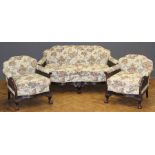A Victorian mahogany drawing room suite, comprising a two person settee and pair of armchairs,